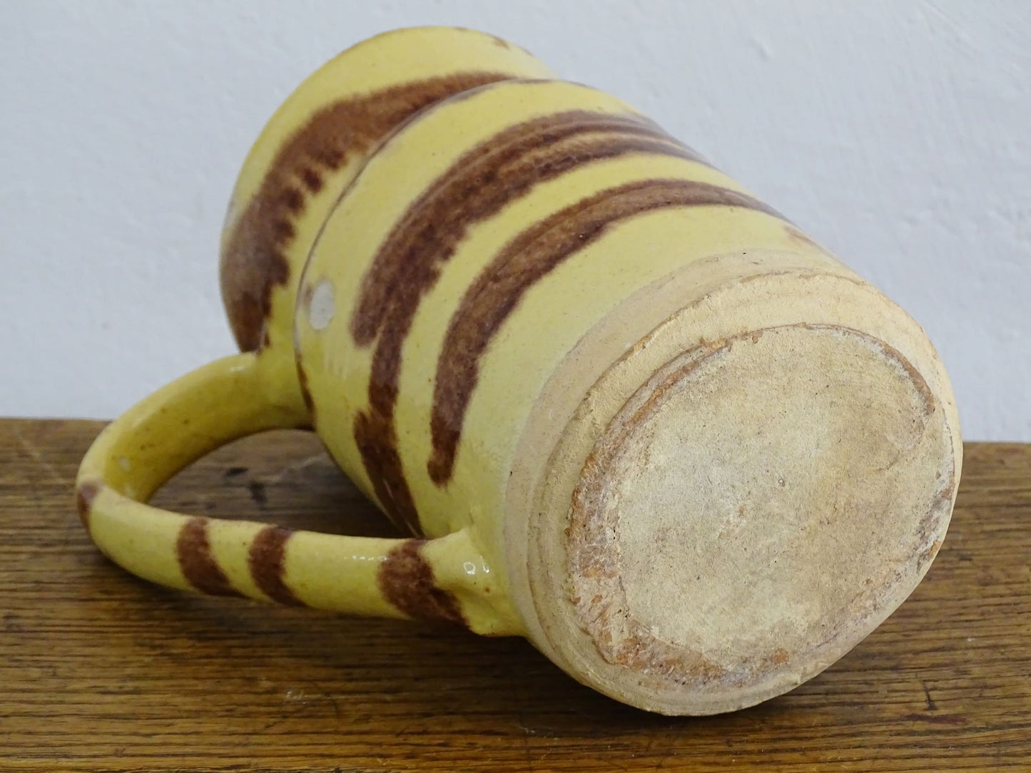 French antique ceramic jug from Dieulefit with a yellow glaze with brown drip glaze stripe.