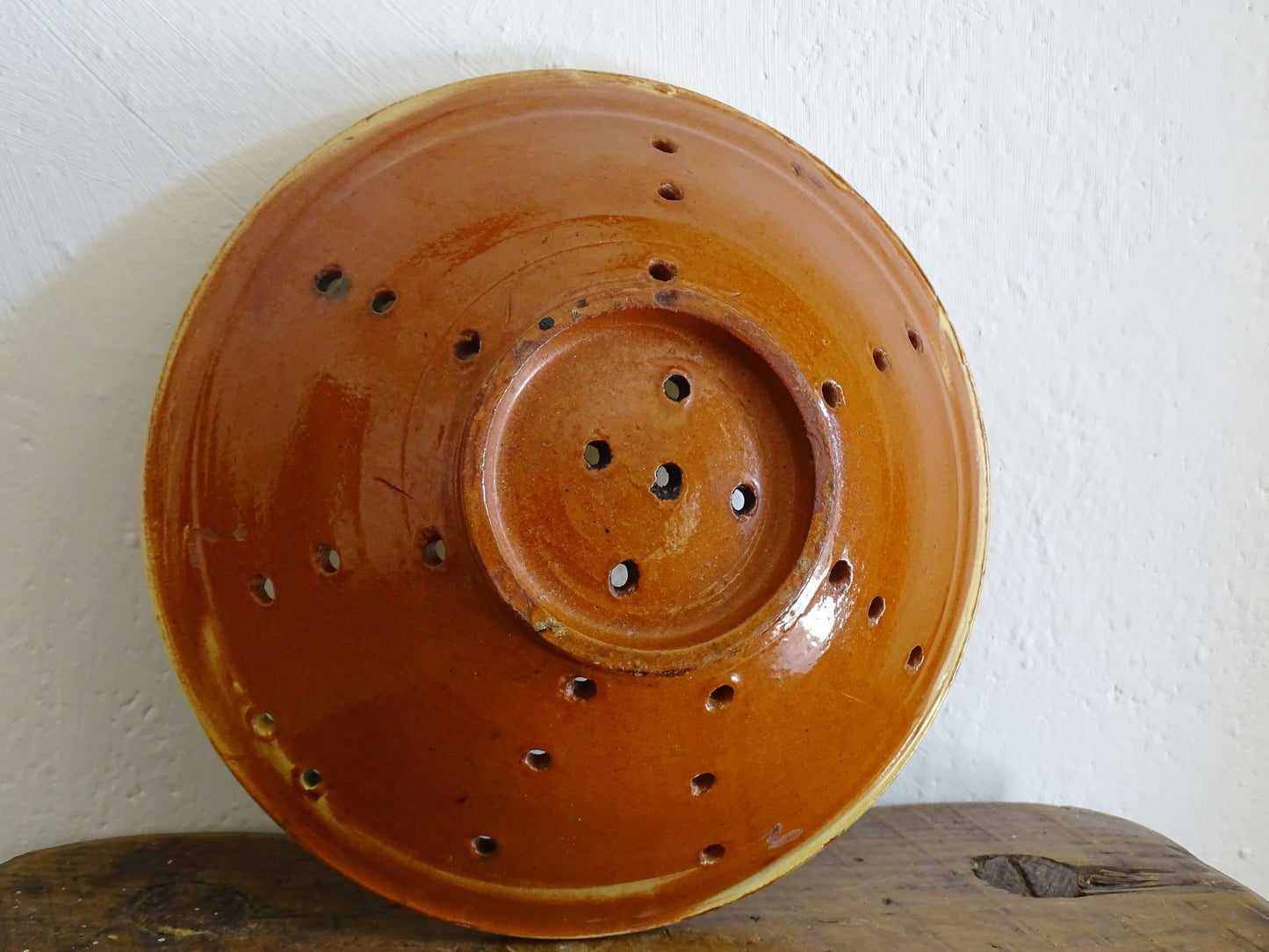 French antique ceramic colander with a yellow and green glaze. Pottery colander for berries. 