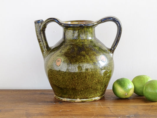 French antique cruche or orjol with an earthy green glaze. Antique terracotta water jug from the Languedoc with a timeworn appearance. French farmhouse aesthetic.