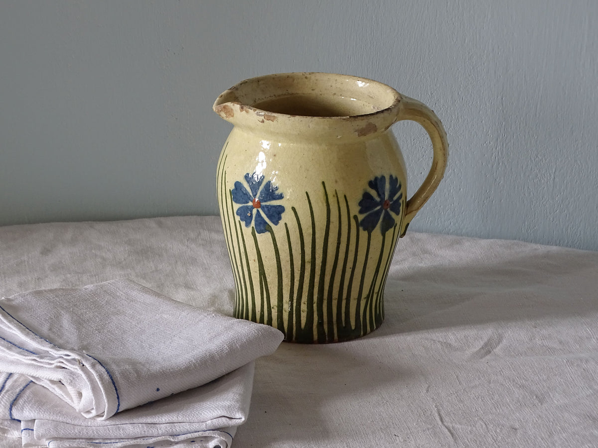 French antique ceramic jug with yellow glaze and hand-painted flowers