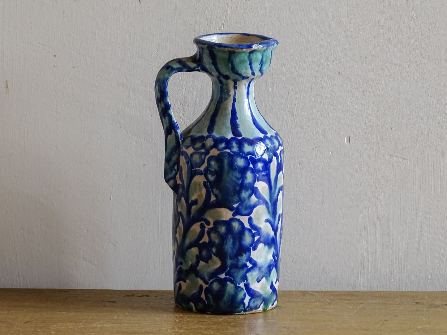 Small Spanish antique Fajalauza pottery pitcher with blue and white glaze