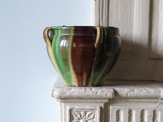 French antique ceramic planter or cache pot from Castelnaudary with a brown, green and yellow glaze, pictured on a country house fireplace