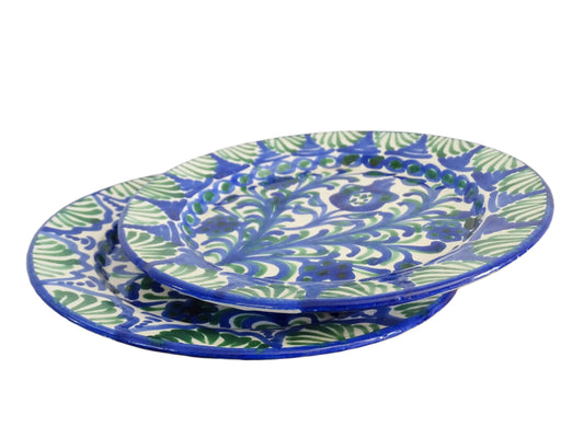 Pair of Spanish vintage Fajalauza plates, hand-painted in green and blue, decorated with flowers, leaves and pomegranates. Tin glazed terracotta plates for wall decor. 
