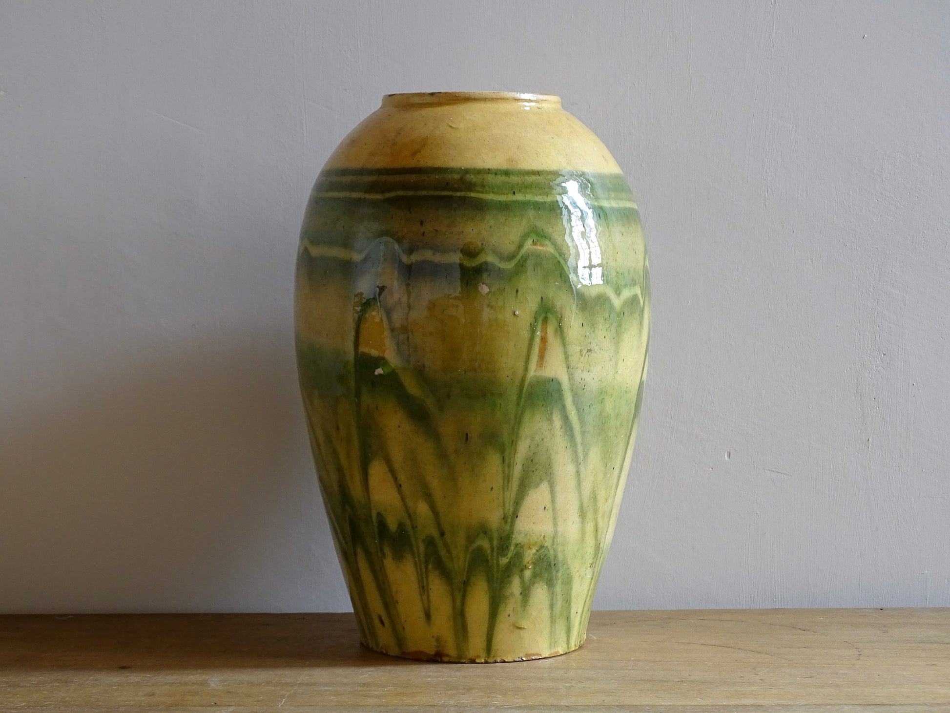 French antique terracotta vase with a green and yellow glaze. Slipware or jaspe pottery vase. Savoie pottery.