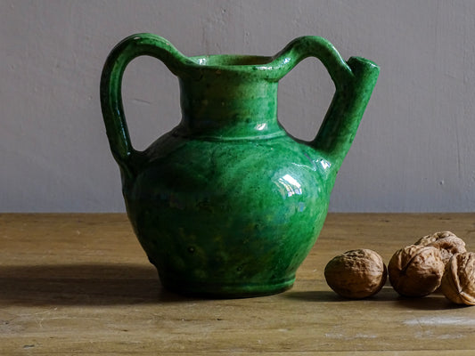 French antique green orjol or cruche in glazed terracotta. The green glaze of this pottery water jug has a pearlescent touch, with a yellow glaze to the interior.