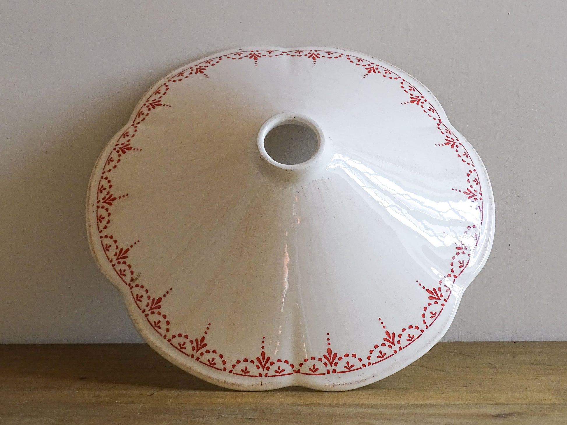 French vintage ceramic lampshade with scalloped edge with red chicken motifs and delicate red patterned detailing. 