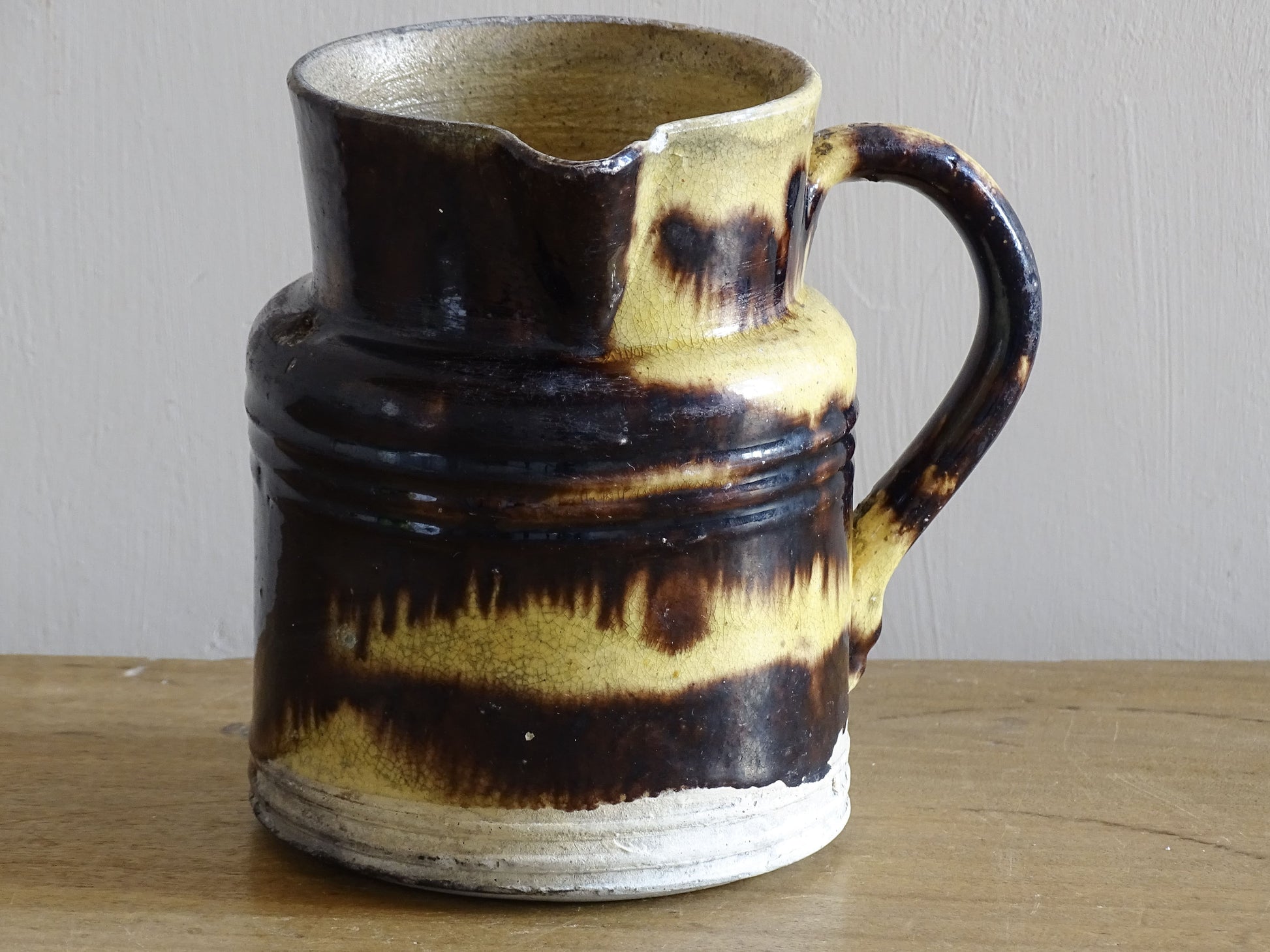 French antique pottery pitcher from Dieulefit with yellow and brown glaze