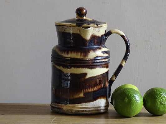 French antique ceramic pitcher with a lid and yellow and brown glaze with organic stripes. Dieulefit Pottery.