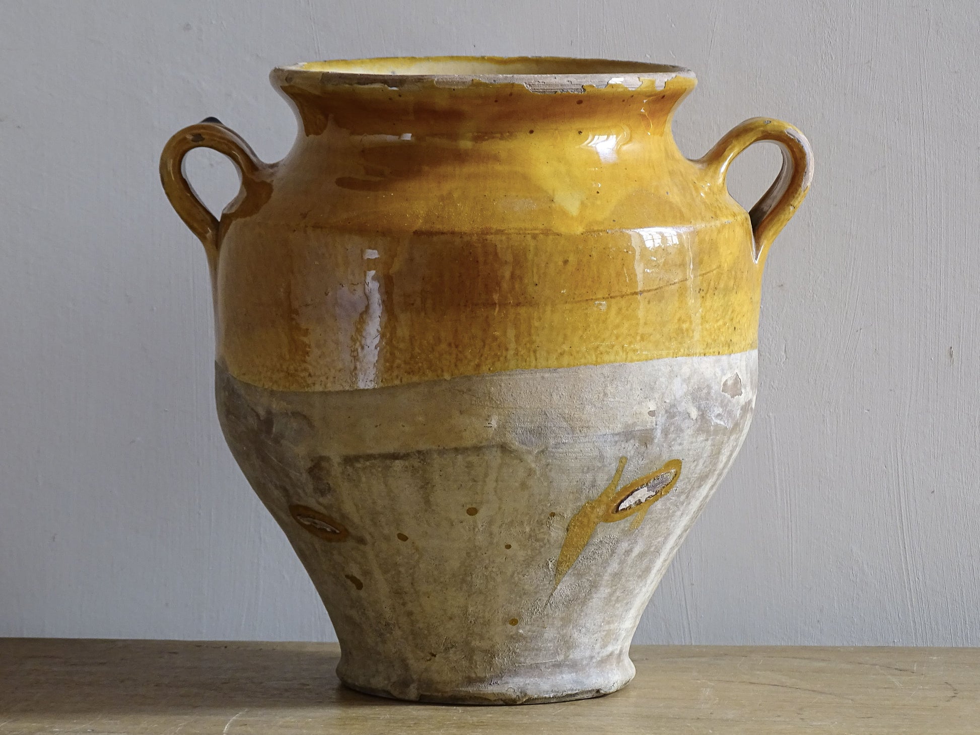 Antique French confit pot with yellow glaze for country house decor