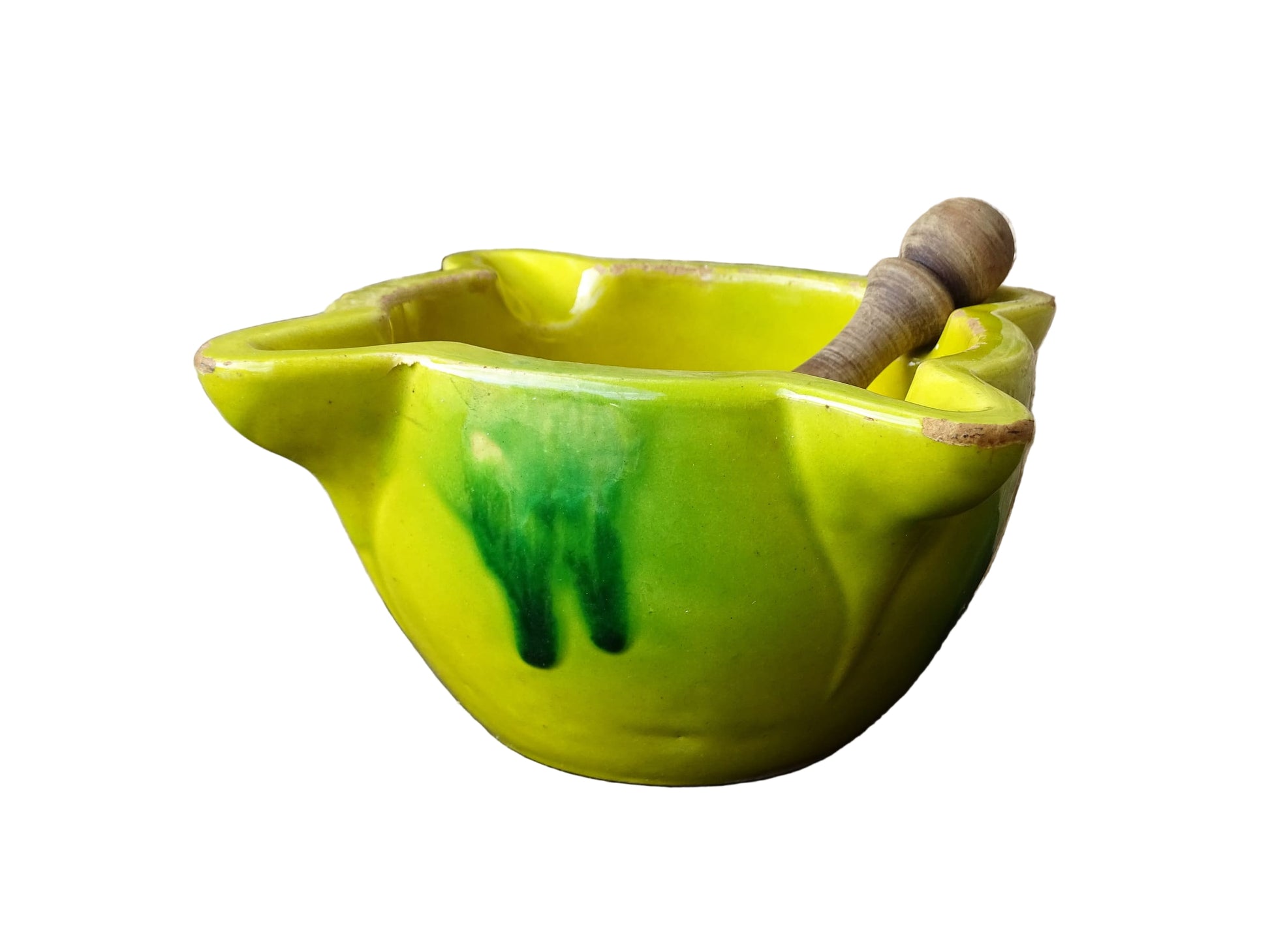 French vintage ceramic pestle and mortar with a yellow glaze and green drip glaze detailing. Wooden pestle with patina.