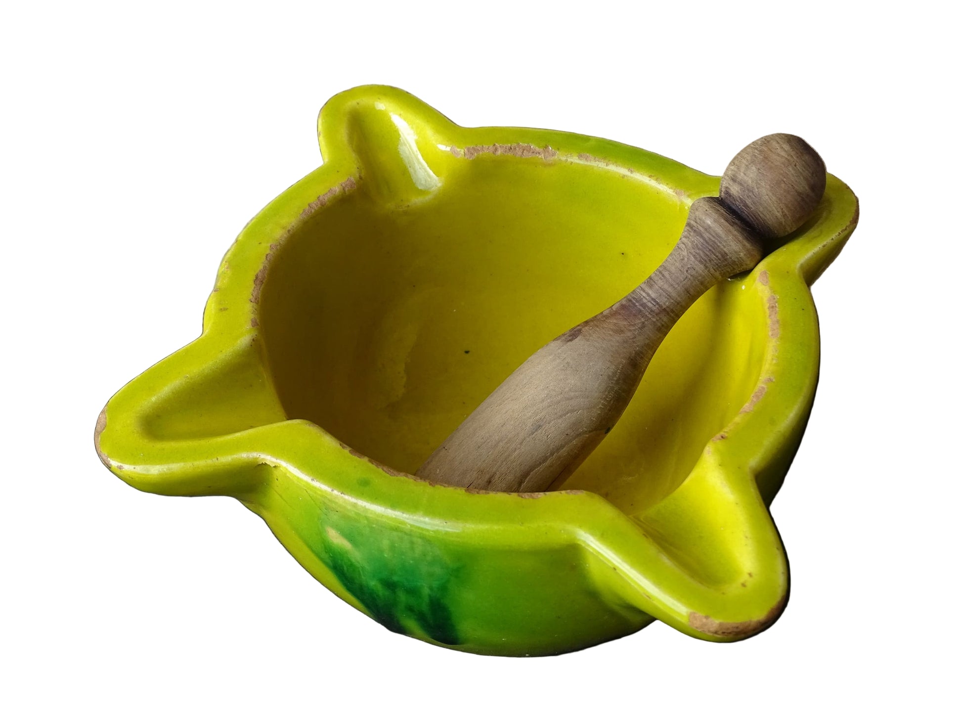 French vintage ceramic pestle and mortar with a yellow glaze and green drip glaze detailing. Wooden pestle with patina.