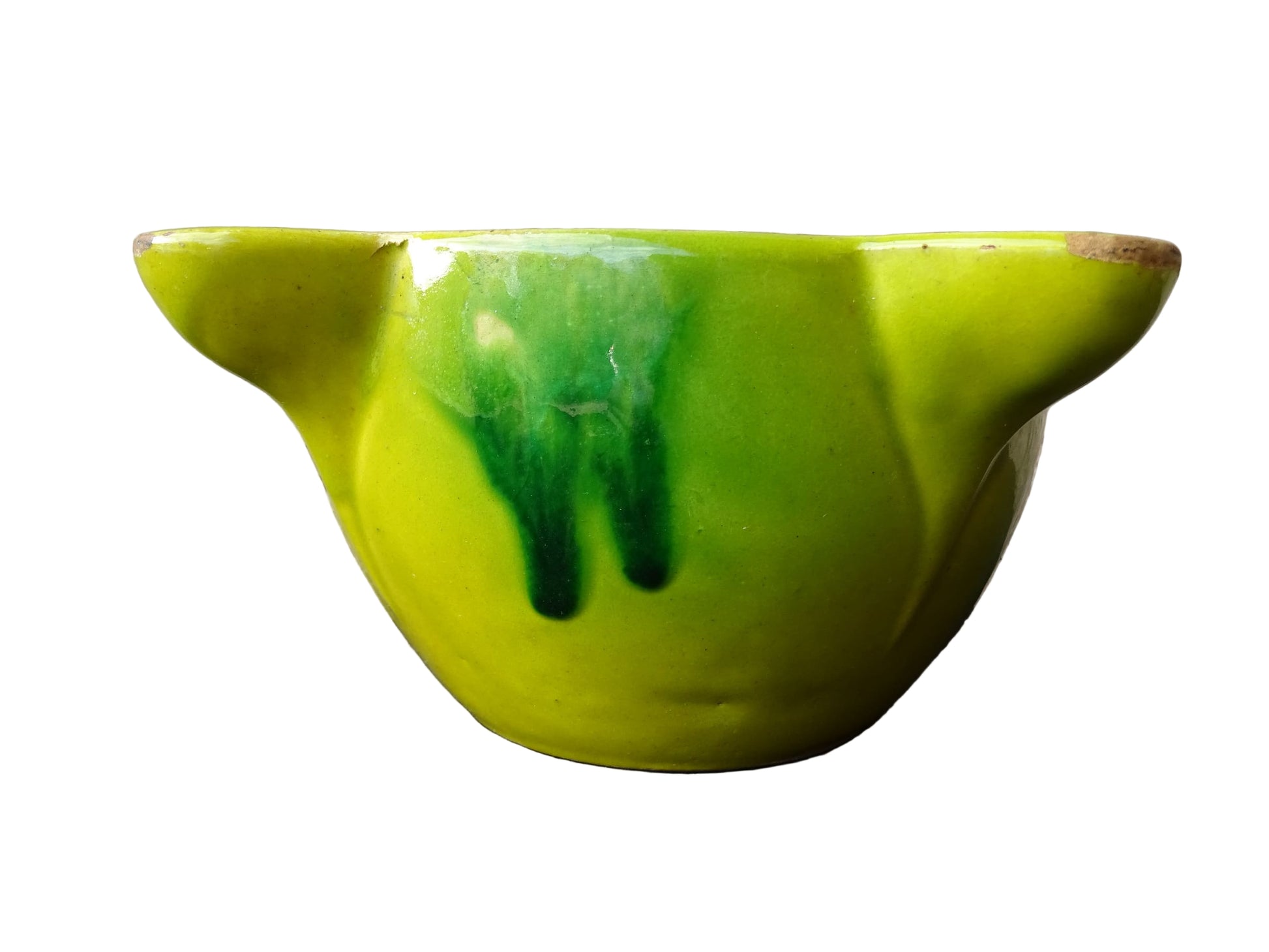 French vintage ceramic pestle and mortar with a yellow glaze and green drip glaze detailing. Wooden pestle with patina.