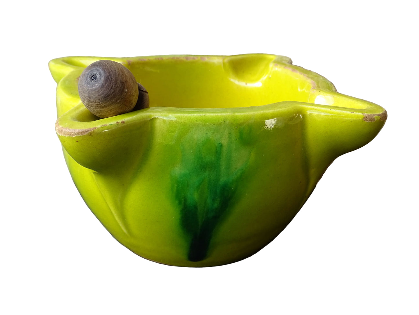 French vintage ceramic pestle and mortar with a yellow glaze and green drip glaze detailing. Wooden pestle with patina.