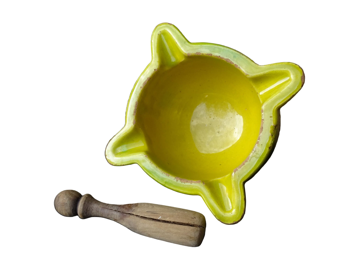 French vintage ceramic pestle and mortar with a yellow glaze and green drip glaze detailing. Wooden pestle with patina.