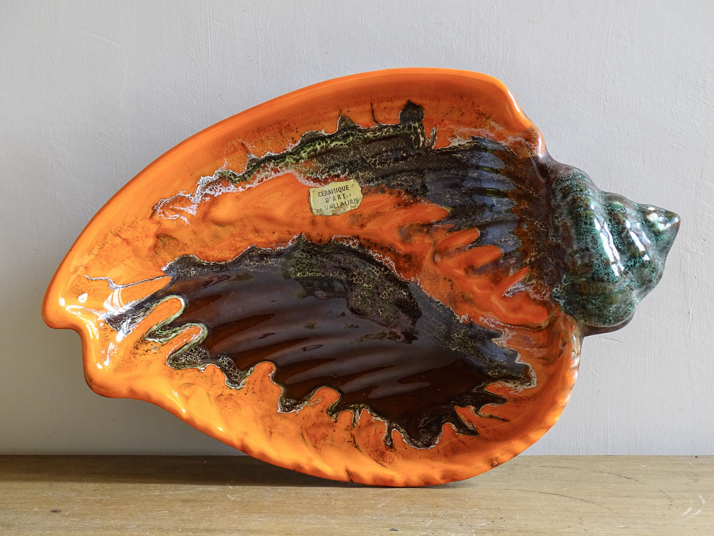 French vintage Vallauris ceramic conch bowl. Orange glazed pottery shell dish. 