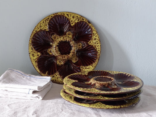 French vintage ceramic oyster plates with yellow and brown glaze, set of four