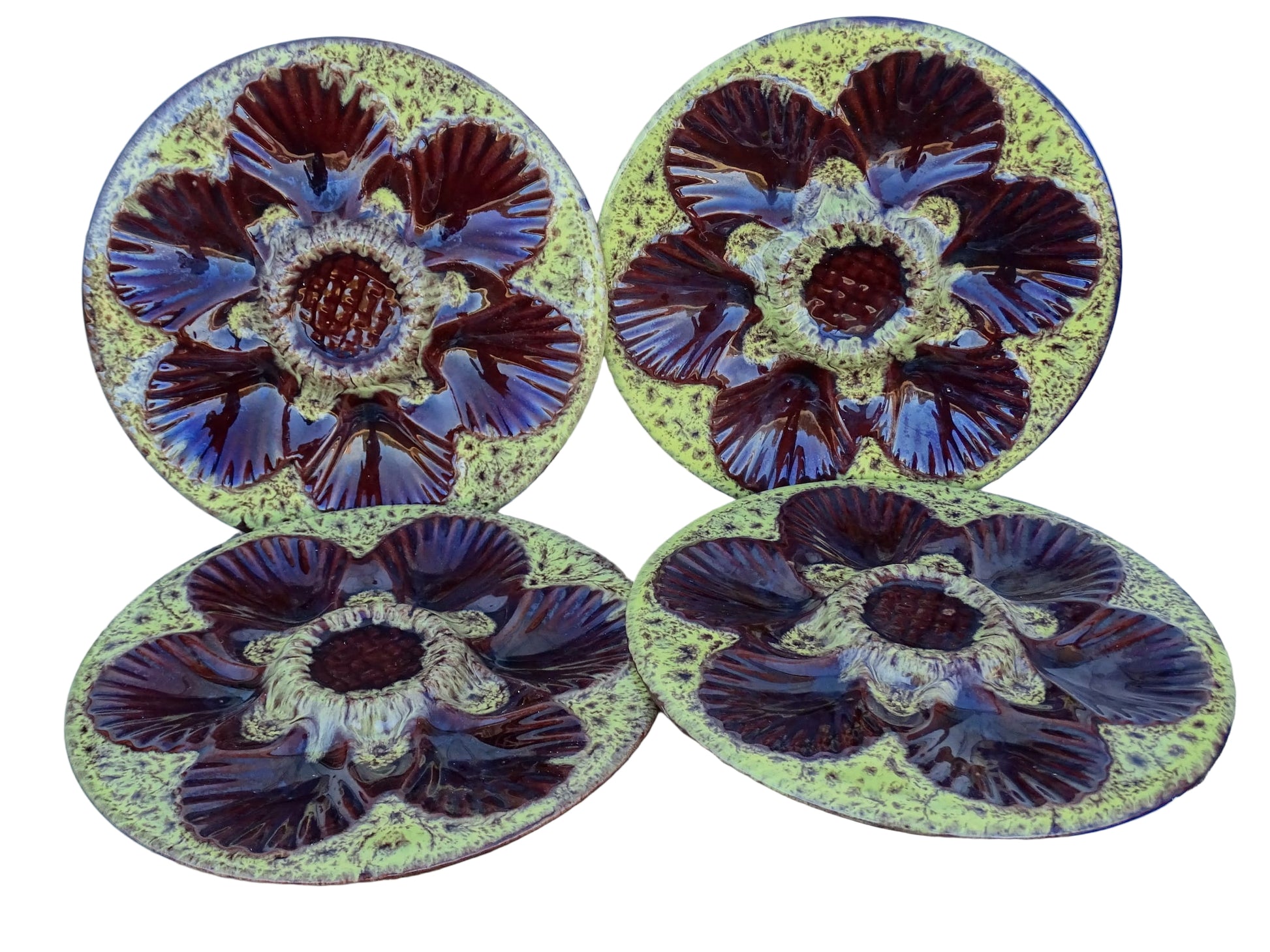 Set of four French vintage Vallauris ceramic oyster plates by Maruis Giuge with space for six oysters. They have a yellow and brown glaze.