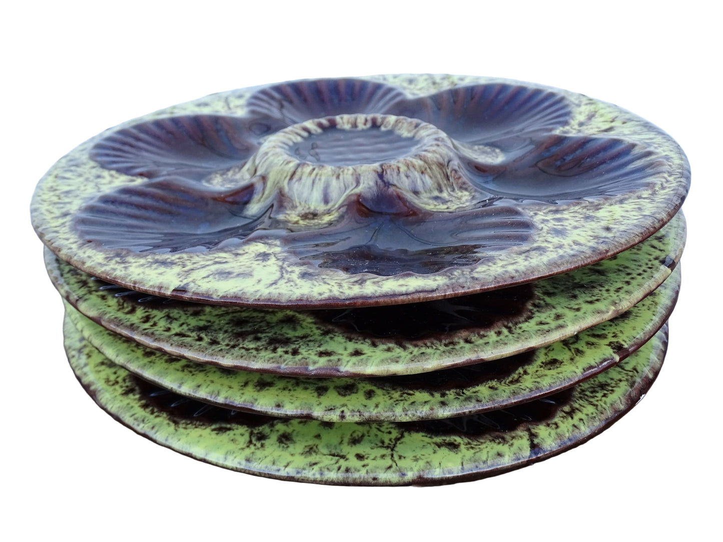 Set of four French vintage Vallauris ceramic oyster plates by Maruis Giuge with space for six oysters. They have a yellow and brown glaze.