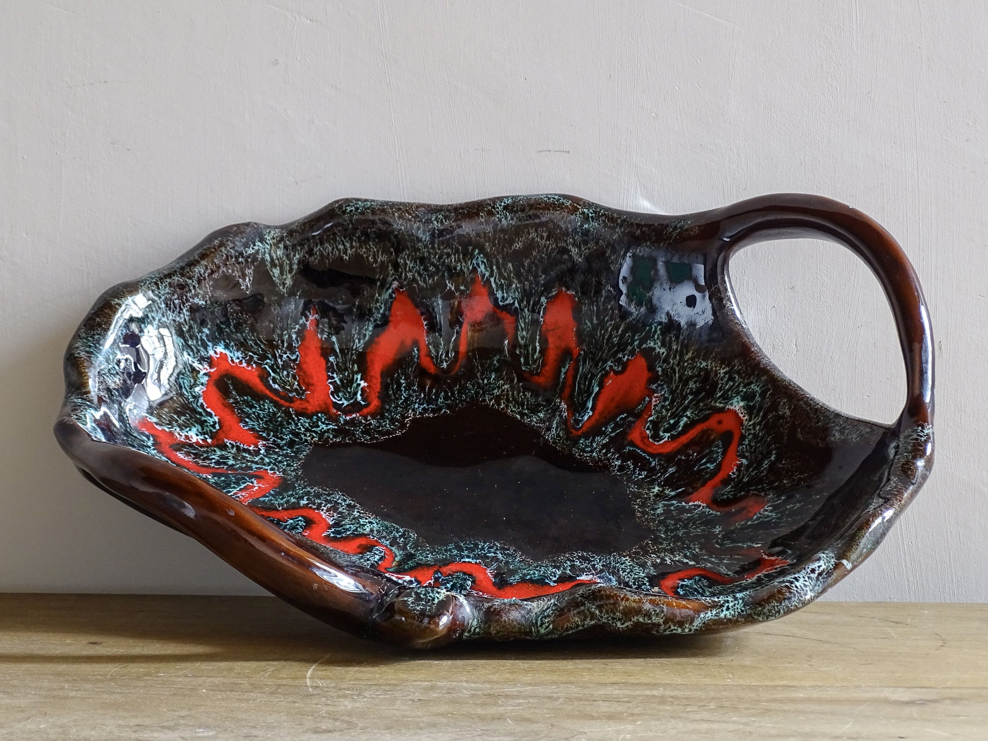 French vintage ceramic Vallauris bowl with two handles and red volcanic glaze