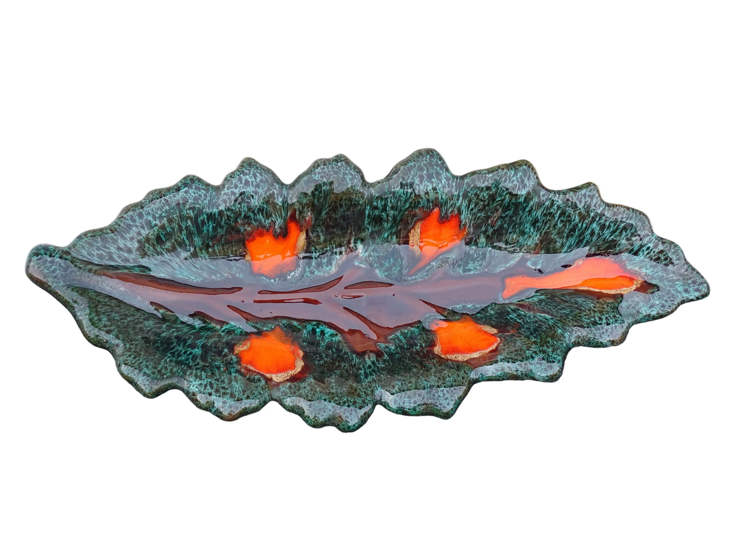 Large French vintage Vallauris ceramic bowl in the shape of a leaf. It is glazed with a dark green with details in brown and orange.