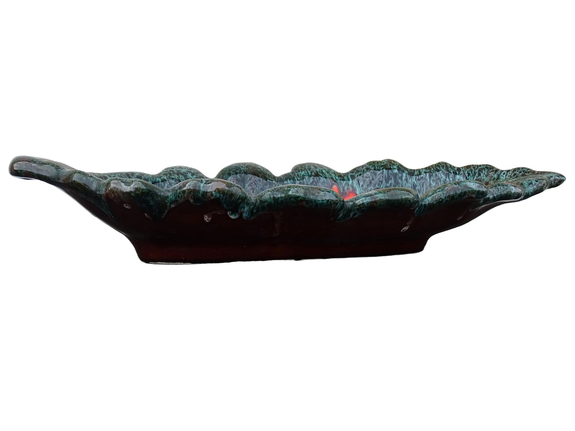 Large French vintage Vallauris ceramic bowl in the shape of a leaf. It is glazed with a dark green with details in brown and orange.
