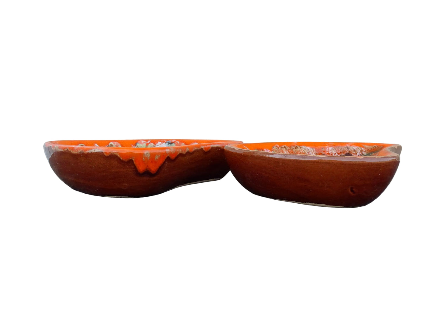 Pair of French vintage Vallauris ceramic dishes. Kidney shaped bowls with orange glaze with mid-century design.