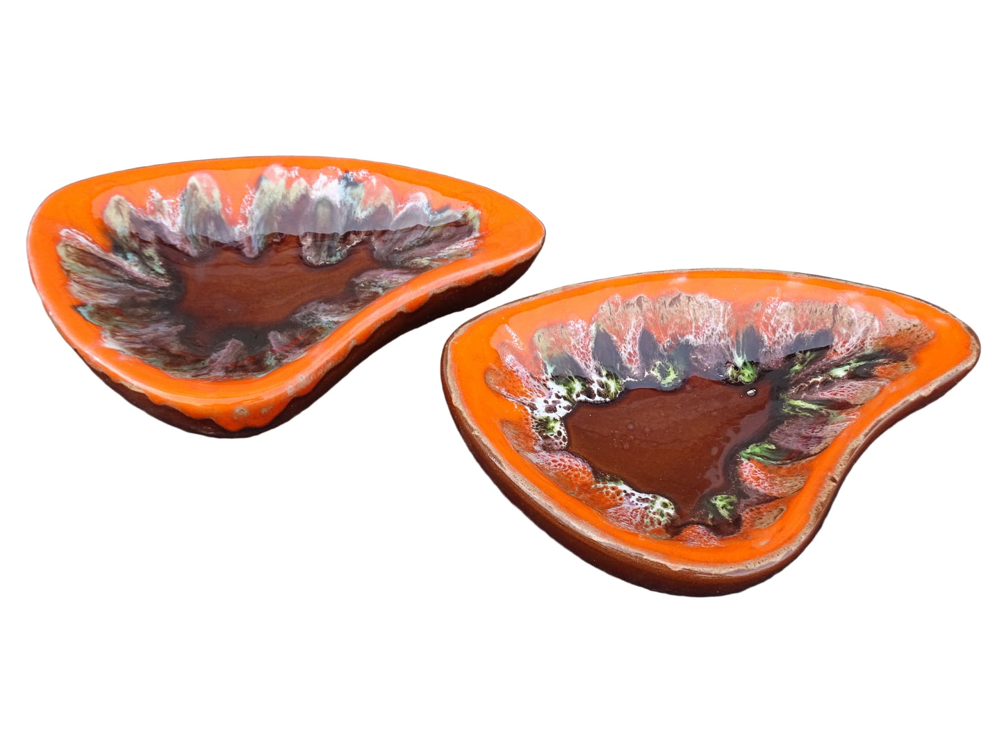 Pair of French vintage Vallauris ceramic dishes. Kidney shaped bowls with orange glaze with mid-century design.
