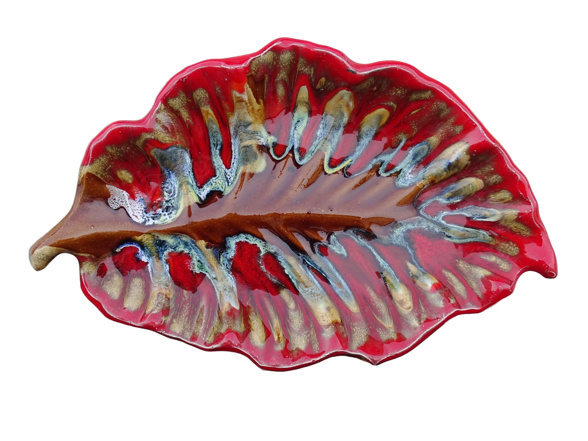 French vintage Vallauris ceramic dish in a leaf design. The pottery dish is glazed in red with details in pale blue, yellow and brown