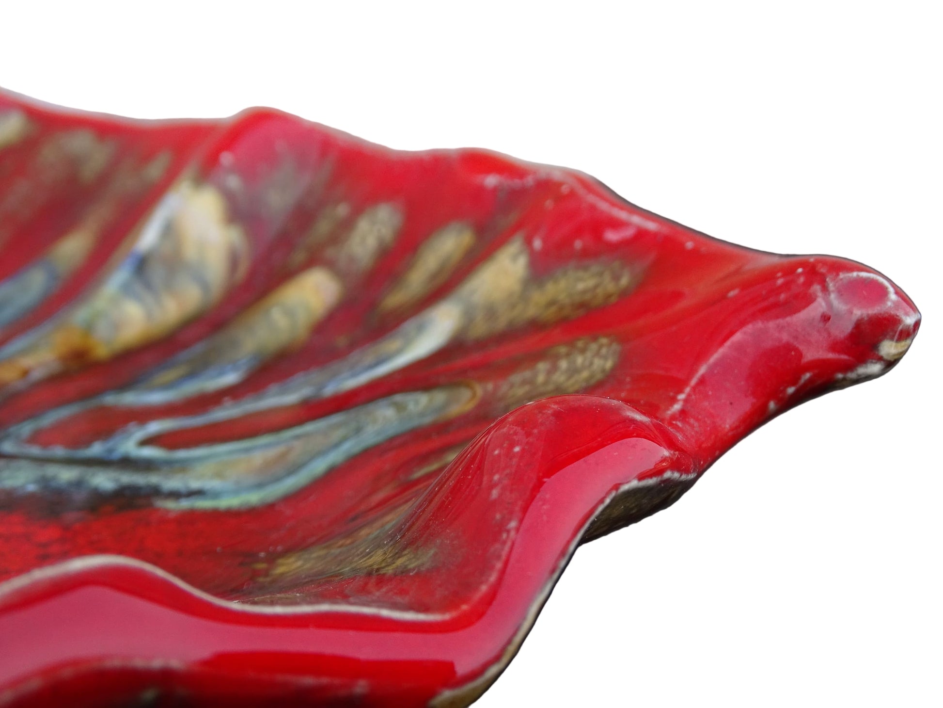 French vintage Vallauris ceramic dish in a leaf design. The pottery dish is glazed in red with details in pale blue, yellow and brown