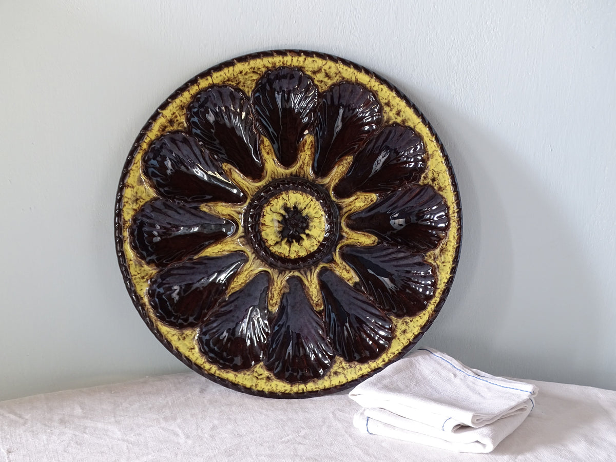 French vintage ceramic oyster plate with yellow and brown glaze by Marius Giuge, Vallauris