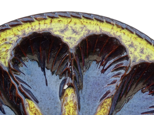 Large French vintage Vallauris pottery oyster plate by Maruis Giuge with space for twelve oysters. It has a yellow and brown glaze.