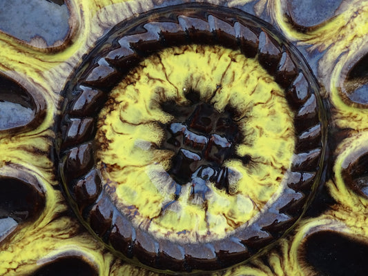 Large French vintage Vallauris pottery oyster plate by Maruis Giuge with space for twelve oysters. It has a yellow and brown glaze.