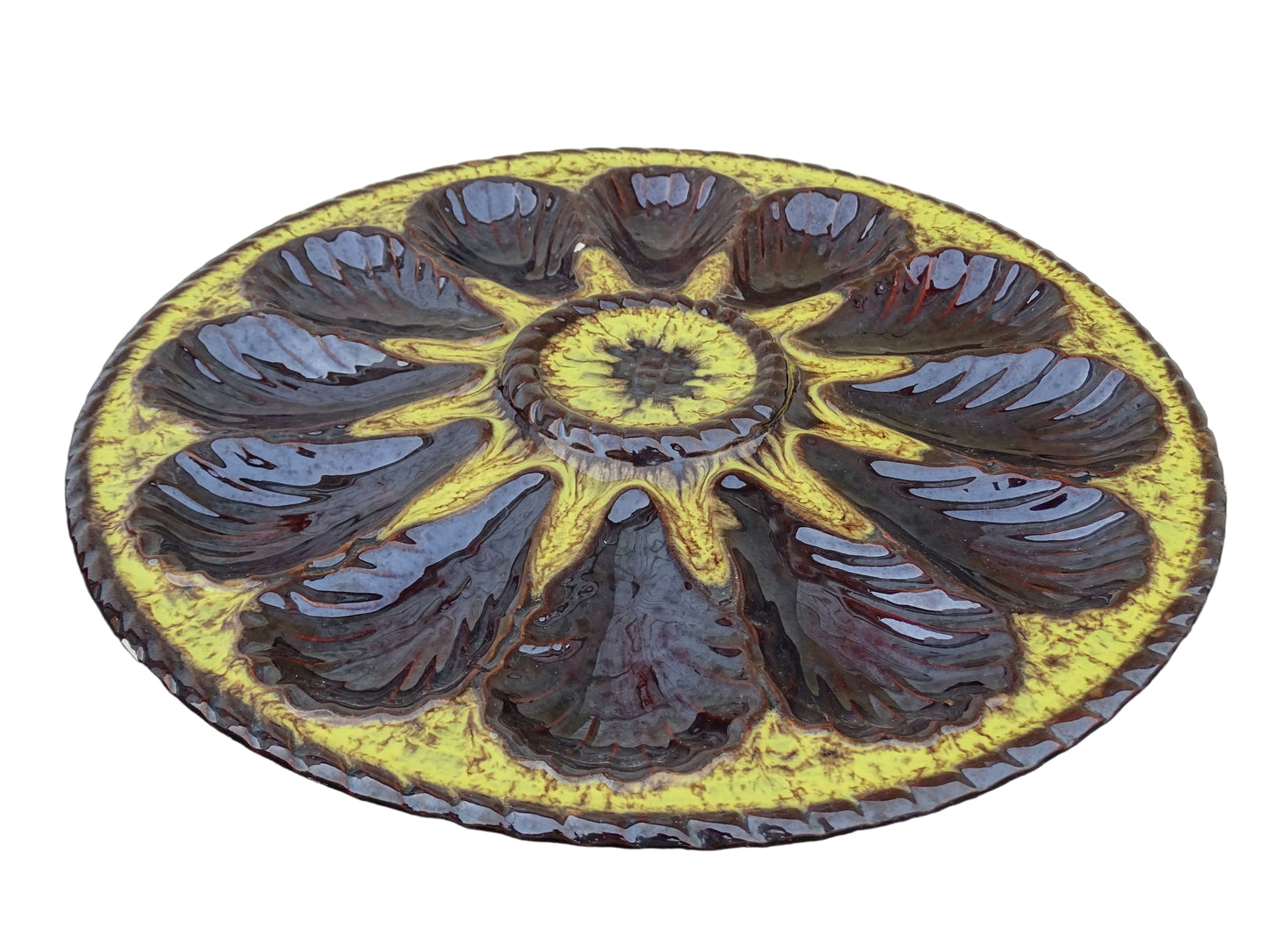Large French vintage Vallauris pottery oyster plate by Maruis Giuge with space for twelve oysters. It has a yellow and brown glaze.