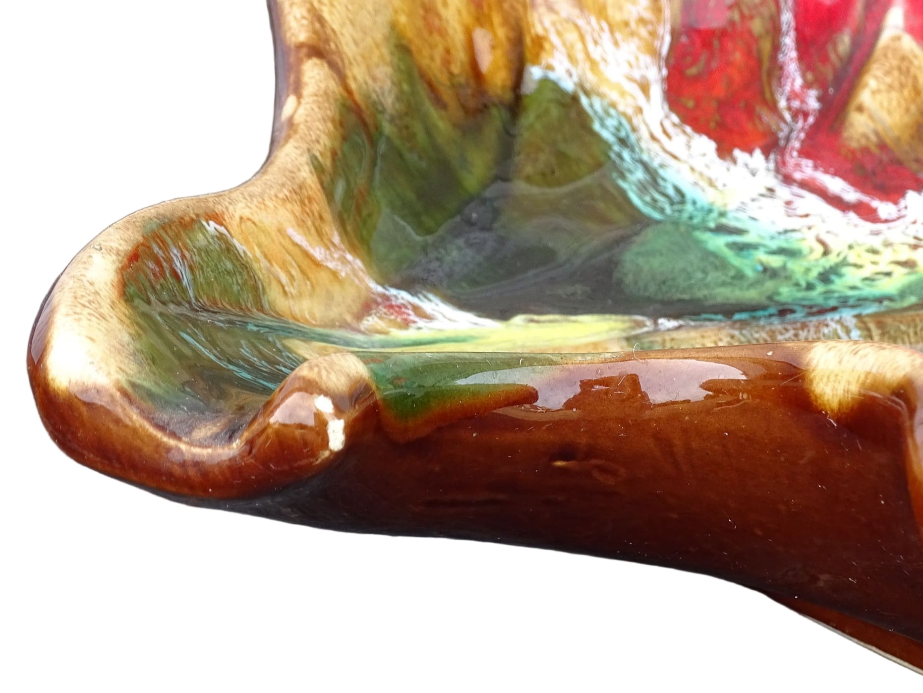 French vintage Vallauris ceramic bowl in a leaf design and glazed in brown and red with details in green, yellow and white. 