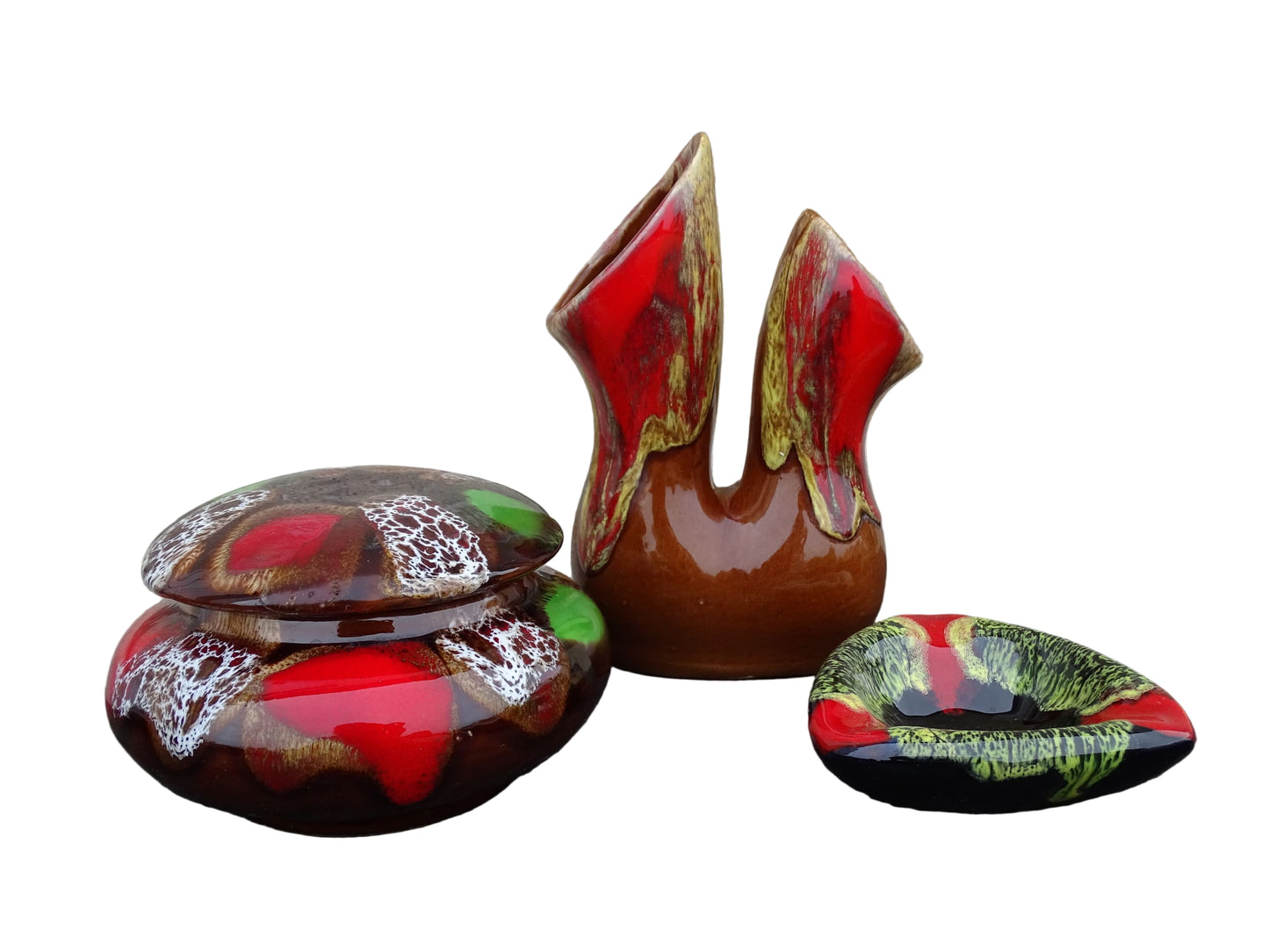 French vintage Vallauris pottery trinket box with brown, red and green glaze. A Vallauris pottery vase with brown, red and yellow glaze. A small Vallauris pottery ashtray with a yellow and red glaze.