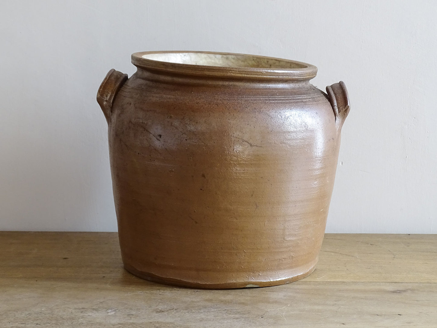 French antique stoneware confit jar with a brown salt glaze. Ceramic cache pot with two handles. 