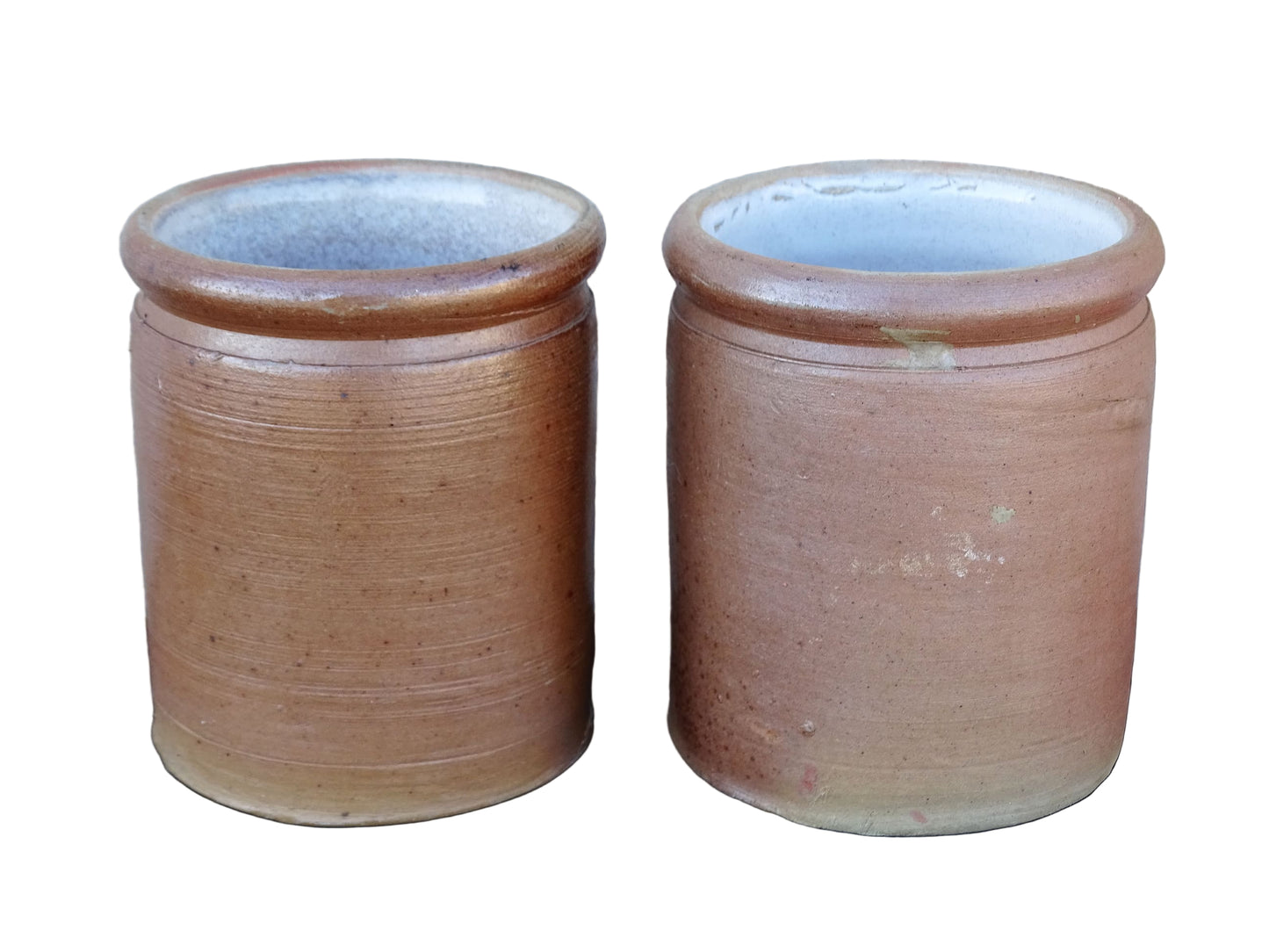 Rustic pair of French vintage stoneware pots with a brown, salt glaze. Old pottery jars with a ribbed texture.