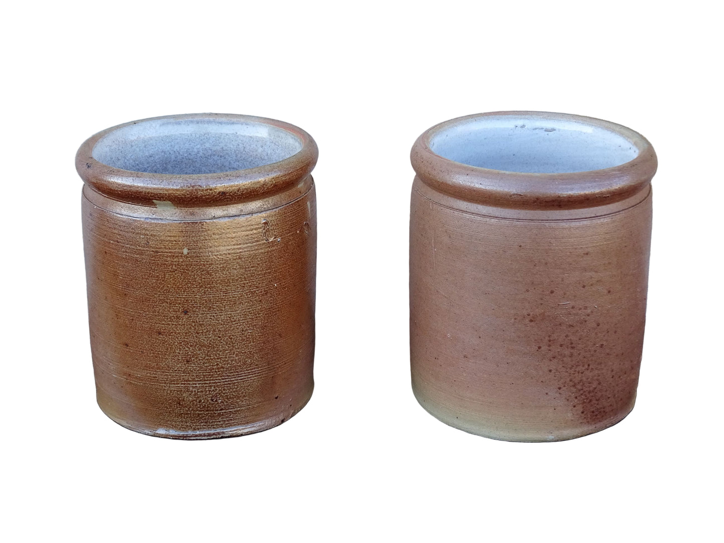 Rustic pair of French vintage stoneware pots with a brown, salt glaze. Old pottery jars with a ribbed texture.