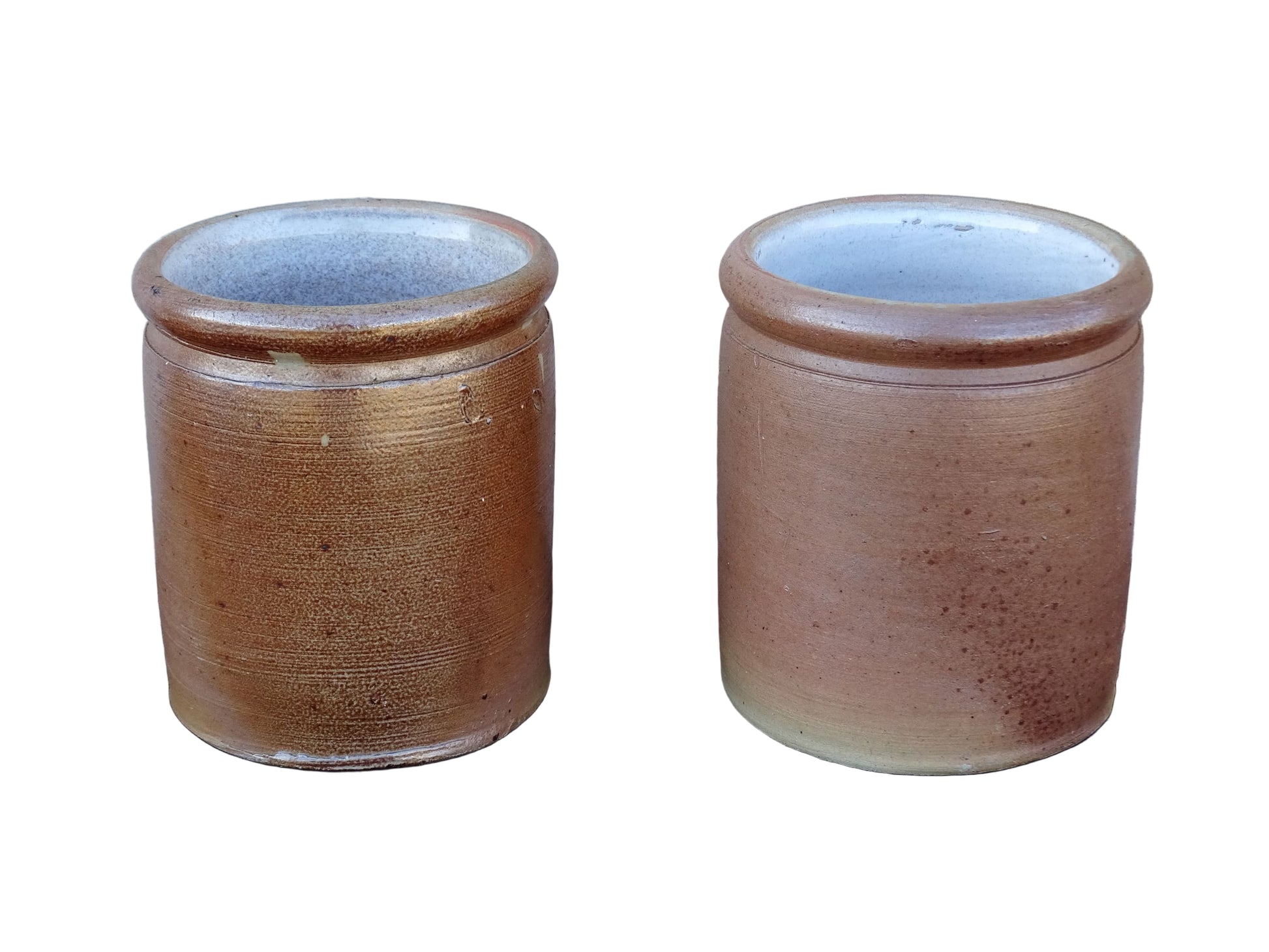 Rustic pair of French vintage stoneware pots with a brown, salt glaze. Old pottery jars with a ribbed texture.