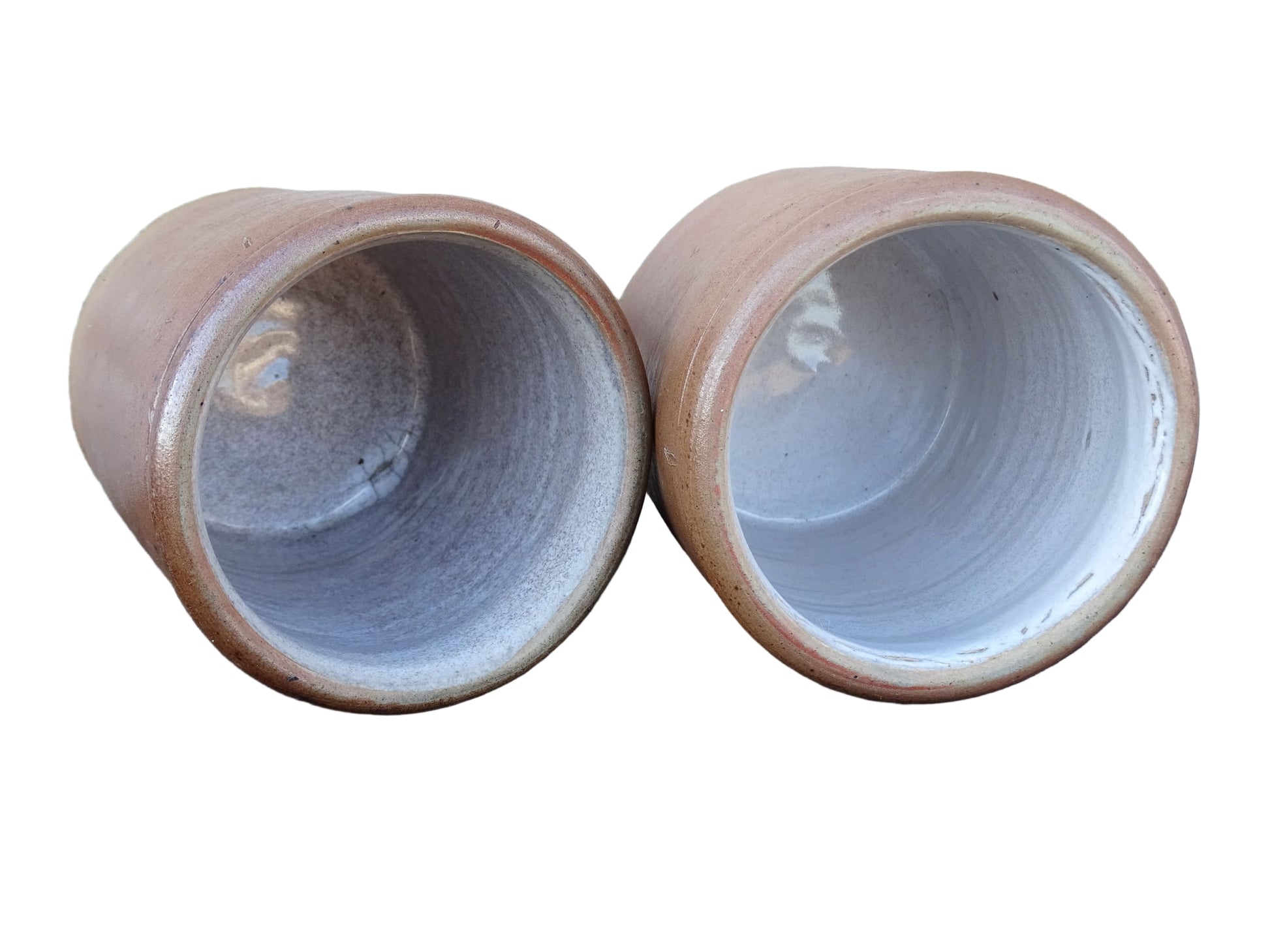 Rustic pair of French vintage stoneware pots with a brown, salt glaze. Old pottery jars with a ribbed texture.