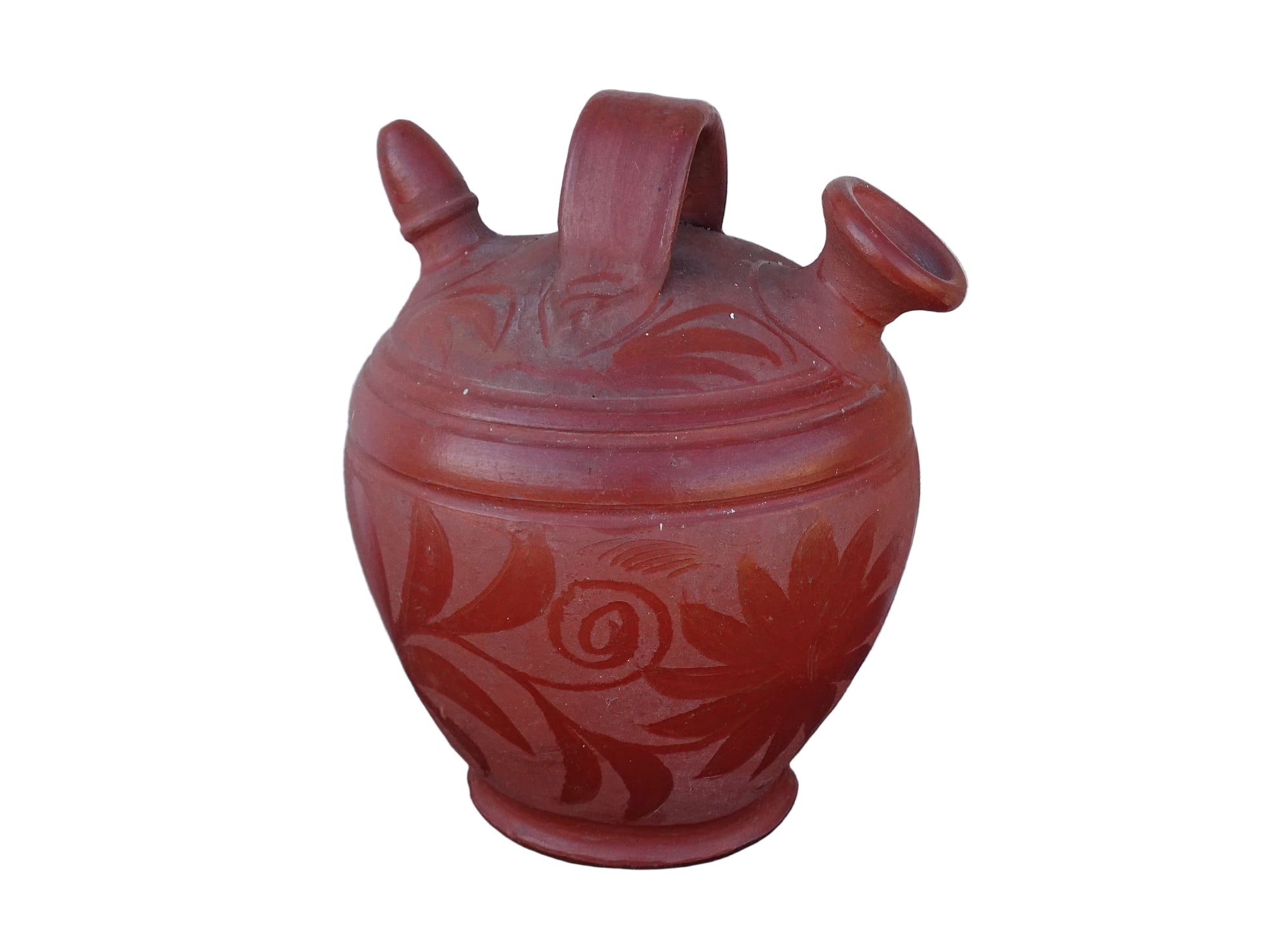 French vintage ceramic gargoulette in a deep red colour with floral detailing. The body of this terracotta jug is a rounded shape with a handle to the top and two spouts.