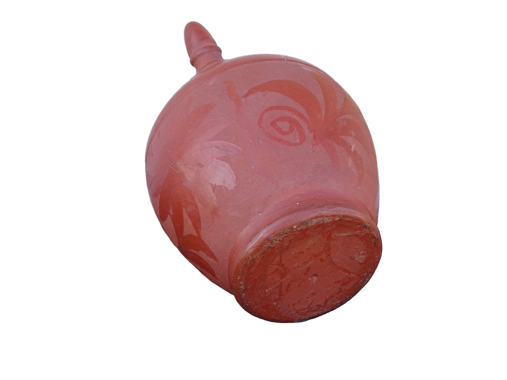 French vintage ceramic gargoulette in a deep red colour with floral detailing. The body of this terracotta jug is a rounded shape with a handle to the top and two spouts.