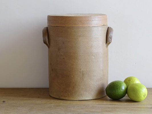 Large vintage French pottery confit jar with lid and handles in a brown glaze.