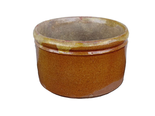 French antique earthenware pot with yellow glaze and timeworn interior. 