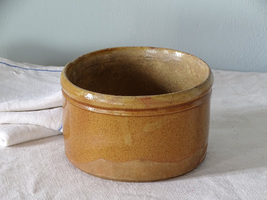 French ceramic jar with red glazed exterior and a yellow glaze to the interior