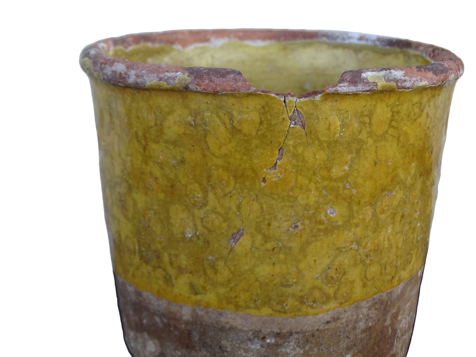 French antique yellow confit pot with patina. Aged earthenware pot with glaze.
