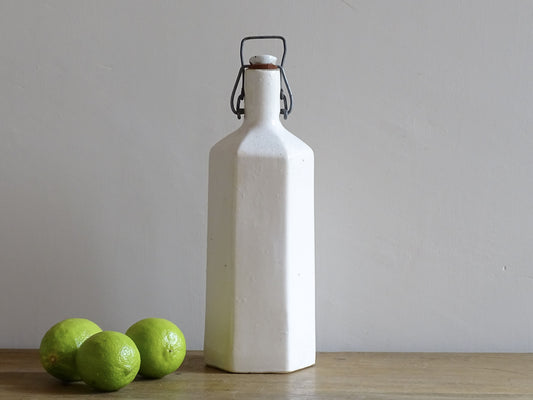 Vintage stoneware bottle with a white glaze.