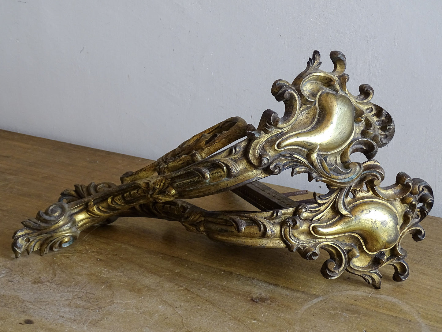 Ornate French antique gilt bronze curtain rod brackets with scrollwork 