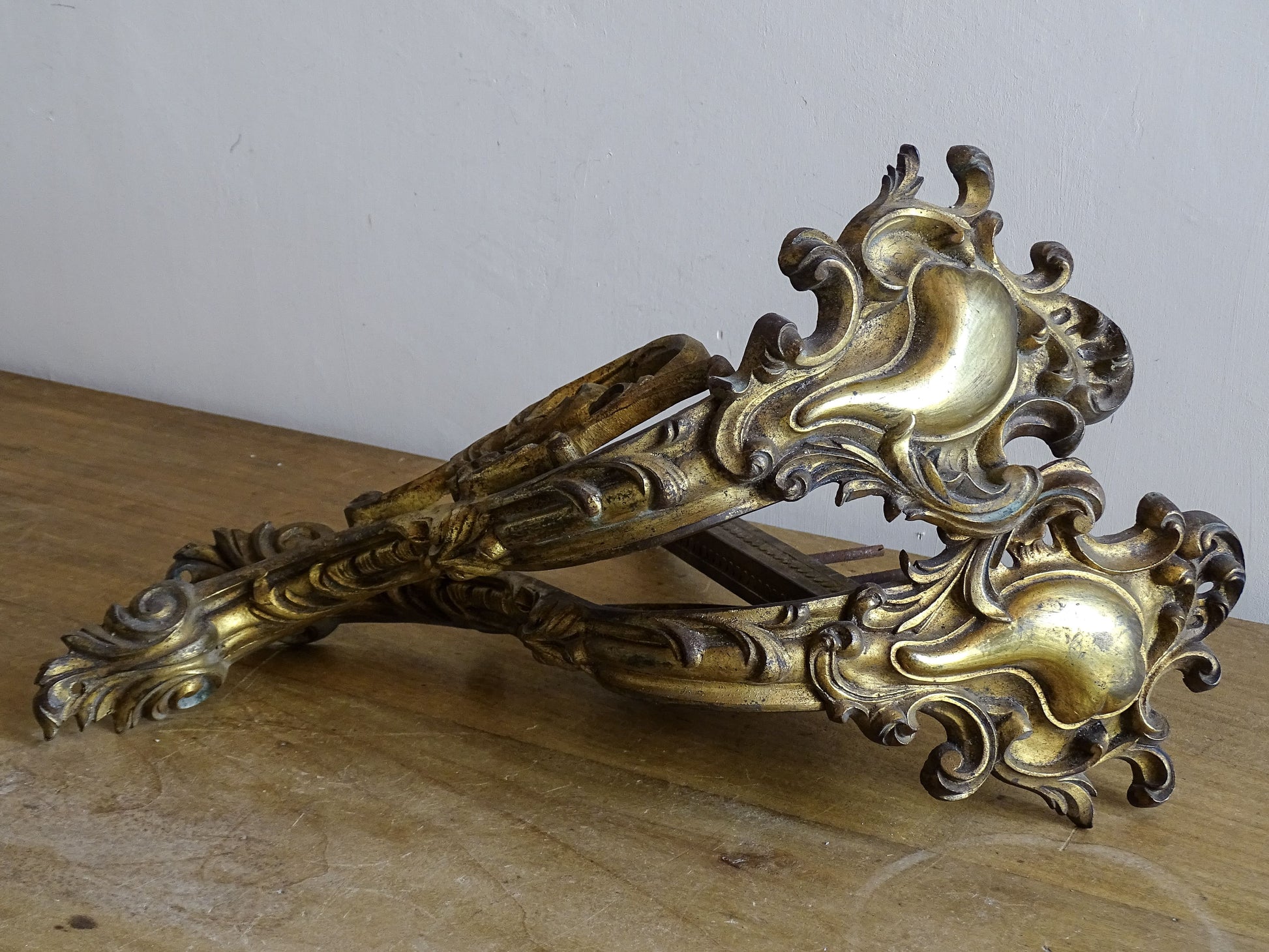 Ornate French antique gilt bronze curtain rod brackets with scrollwork 