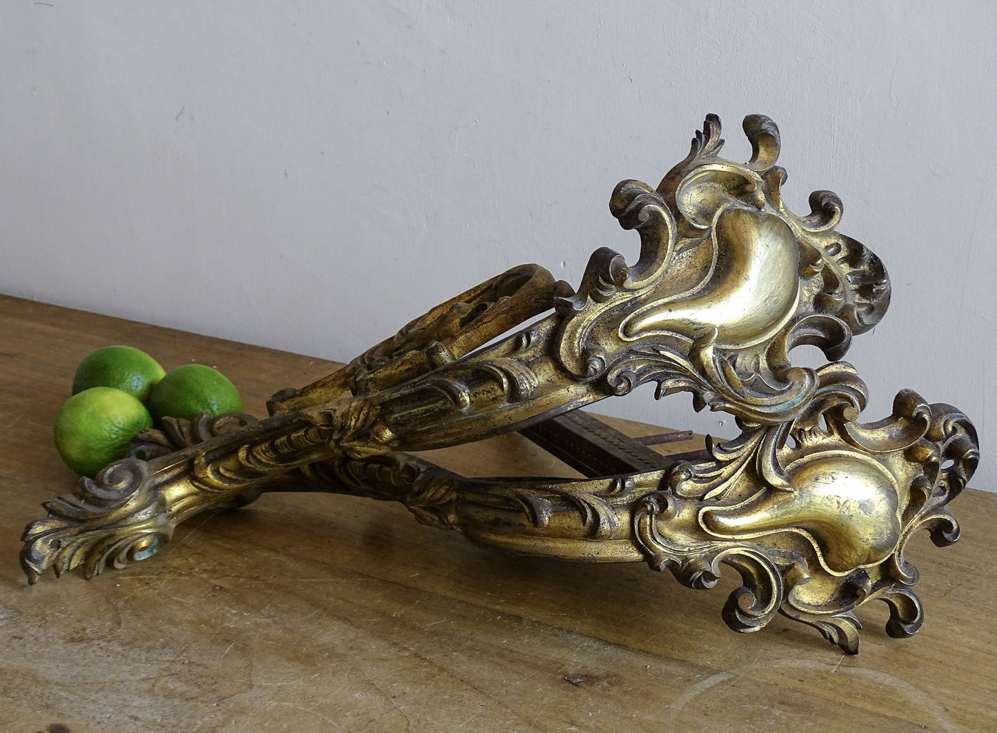 Ornate French antique gilt bronze curtain rod brackets with scrollwork 